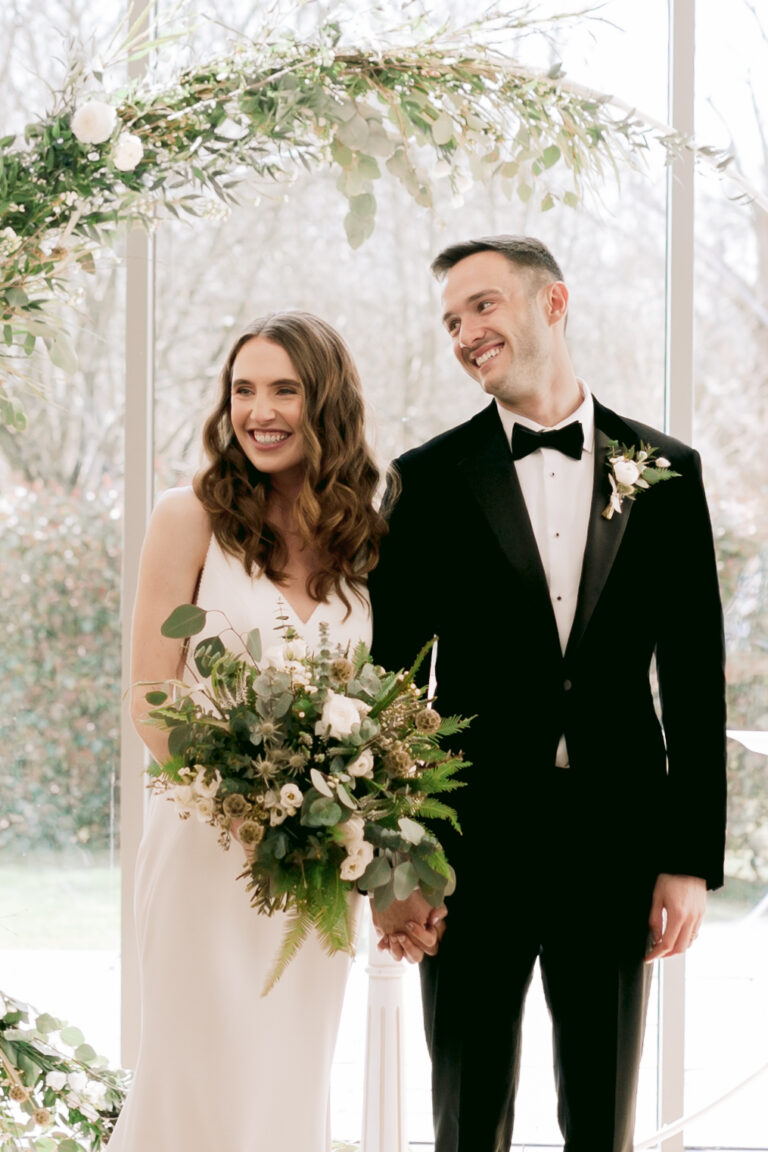 Happy Bride & Groom during their wedding ceremony at Millbridge Court, Surrey.